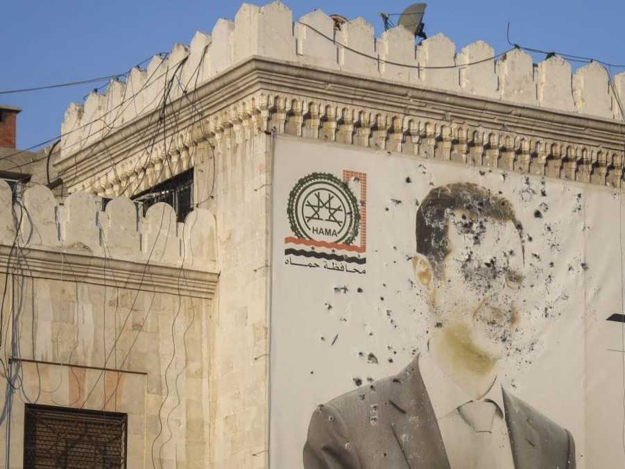 Na snímke prestrieľaný portrét Bašára Asana.