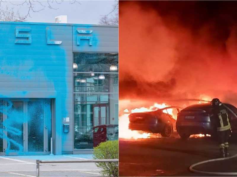 Na snímke postriekaná predajňa Tesly modrou farbou a požiar áut.