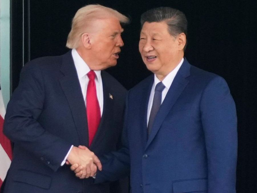 Na snímke Trump a Si Ťin-pching.